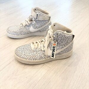 Nike Cream and Black Text High-Tops